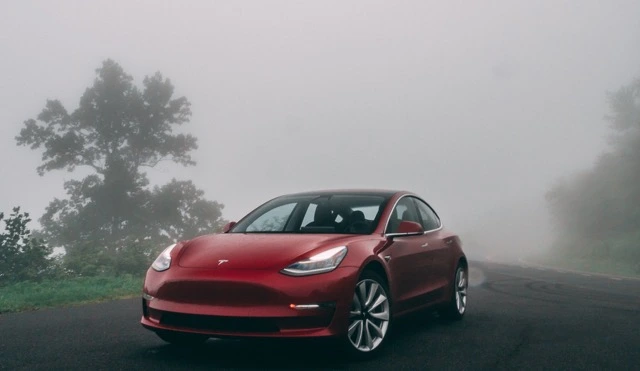 Tesla model 3 in mist